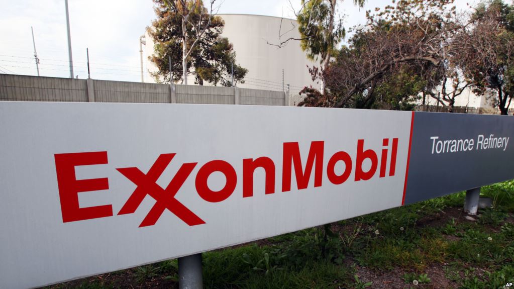 FILE - This Jan. 30, 2012, file photo, shows the sign for the Exxon Mobil Torrance Refinery in Torrance, Calif. Exxon Mobil Corp. reports financial results Friday, April 29, 2016. (AP Photo/Reed Saxon, File)