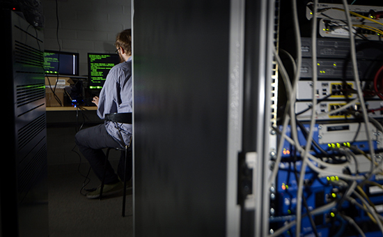 A man types on a keyboard in a computer server room in Helsinki in this August 6, 2014 illustration picture. LEHTIKUVA Markku Ulander