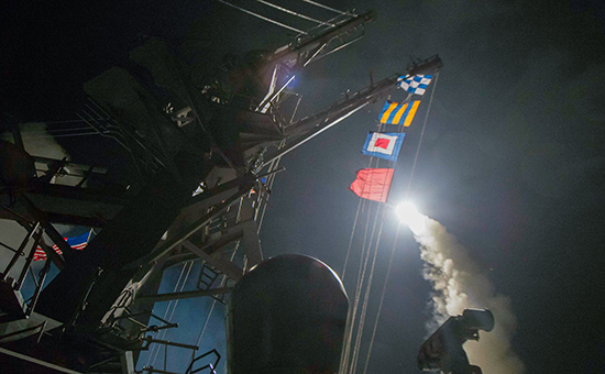 In this image provided by the U.S. Navy, the USS Ross (DDG 71) fires a tomahawk land attack missile Friday, April 7, 2017, from the Mediterranean Sea. The United States blasted a Syrian air base with a barrage of cruise missiles in fiery retaliation for this week's gruesome chemical weapons attack against civilians.  (Mass Communication Specialist 3rd Class Robert S. Price/U.S. Navy via AP)